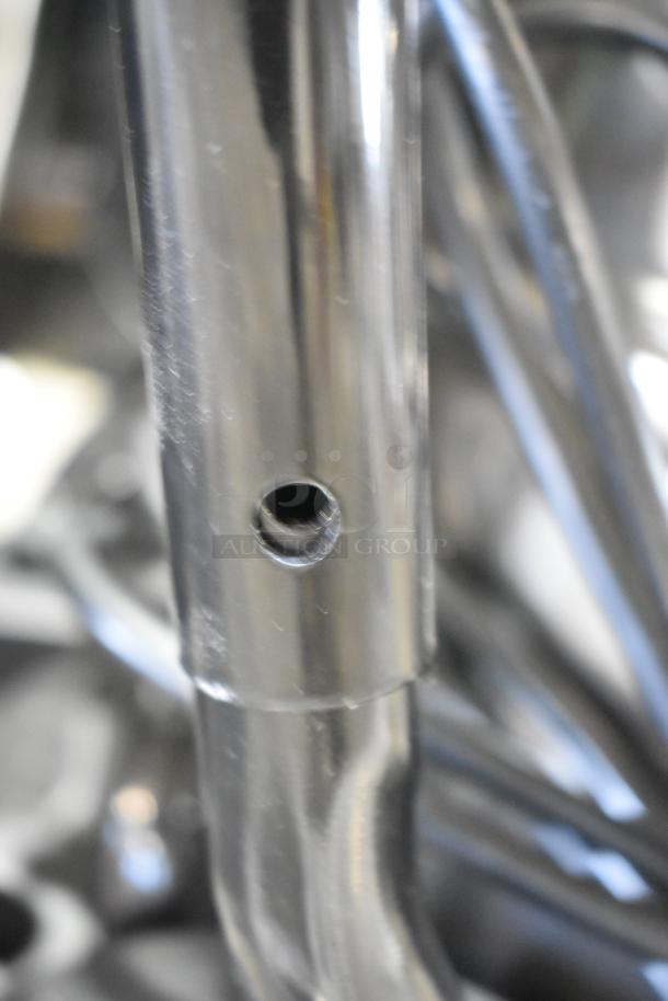 Close-up of stainless steel component from the Lavex 944BJ14121G 21-gallon commercial wet/dry vacuum. Scratch visible.