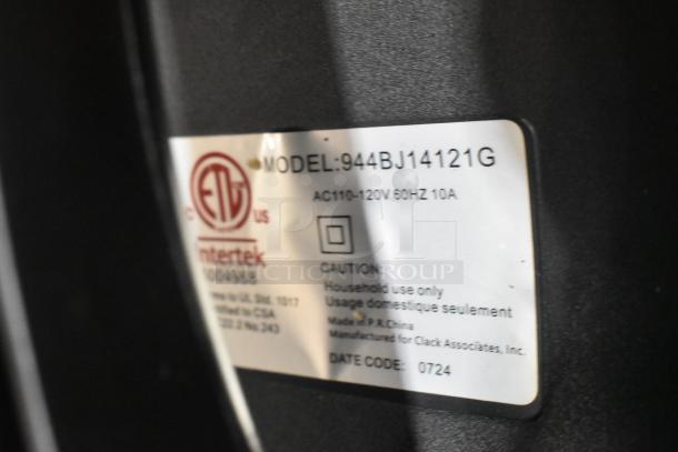 Label on Lavex 944BJ14121G wet/dry vacuum showing model number, voltage, and usage warnings. Date code: 0724.