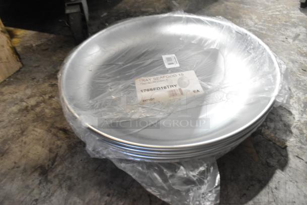 Stack of new Choice aluminum trays with label 176SFD16TRY, 15.75"x2". Slight scratches visible. Plastic wrapped.