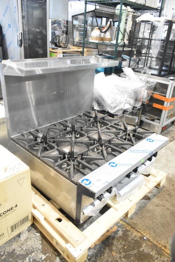 Brand new Garland G36-6T stainless steel 6-burner range, natural gas, with backsplash, labeled Novacel protective film.