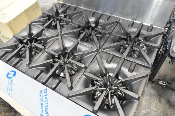 BRAND NEW Garland G36-6T stainless steel 6-burner range, natural gas powered, with back splash. Scratch and dent condition.