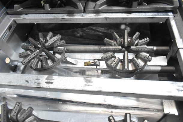BRAND NEW Garland G36-6T stainless steel commercial range with 6 burners. Natural gas powered; scratch and dent condition.