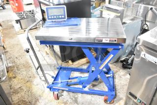 Brand new Vestil CART-500-SCL blue steel hydraulic scissor lift cart with scale, 32"x19.5", 14"-38" lift, 500 lb. capacity.