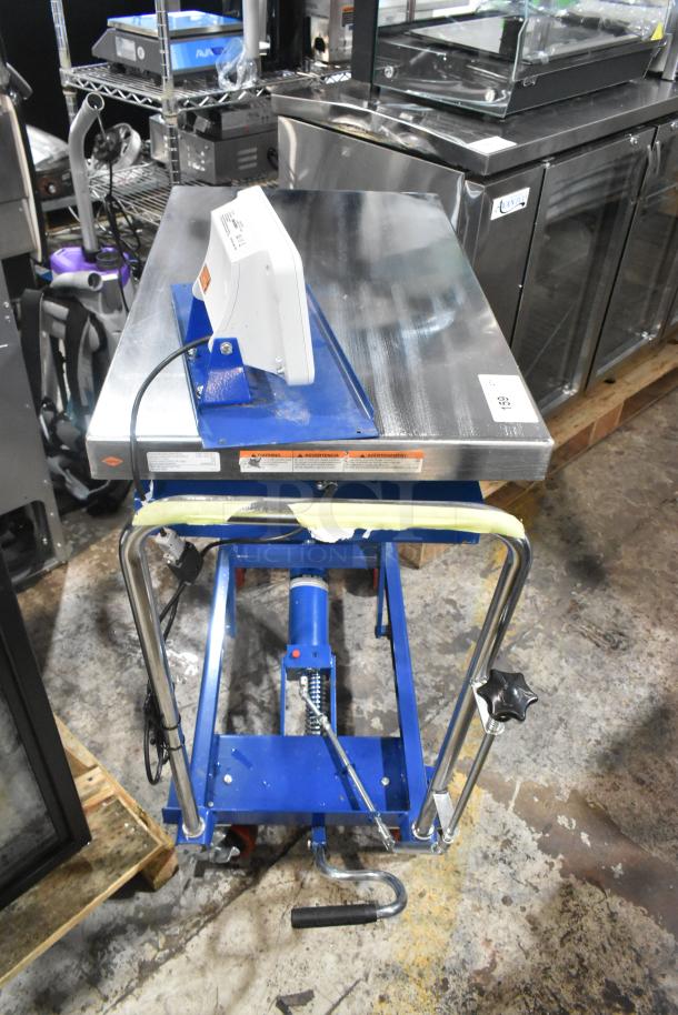 Brand new Vestil CART-500-SCL 32"x19.5" blue steel scissor lift cart, 14"-38" lift, 500 lb. capacity, minor scratches.
