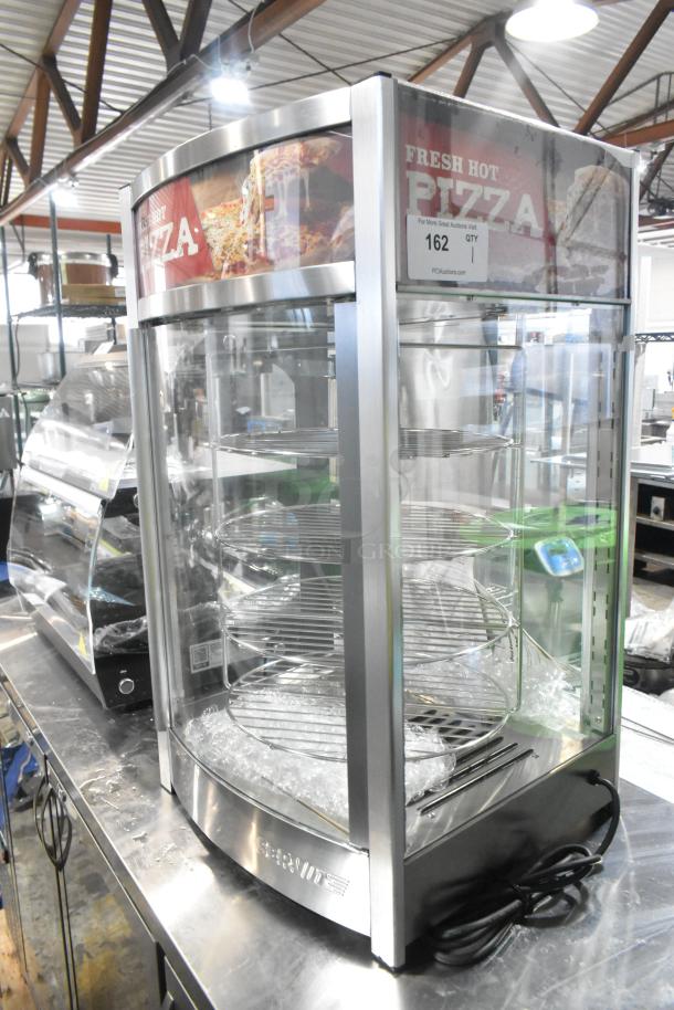 Brand new ServIt 423PDW12D2 12" stainless steel pizza warmer with 4-shelf rotating rack, 120V, 1 Phase, scratch and dent condition.