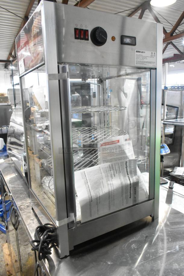 Brand new ServIt 423PDW12D2 stainless steel 12" self-service pizza warmer with 4-shelf rotating rack, 120V, scratch and dent.