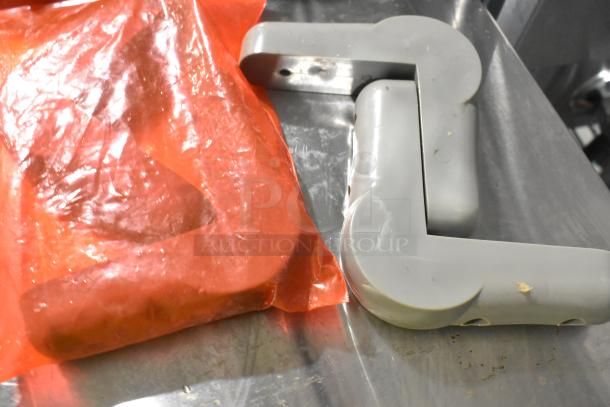 Lot of 4 commercial casters, brand new with minor scratches and dents. Includes red packaging, visible marks on items.