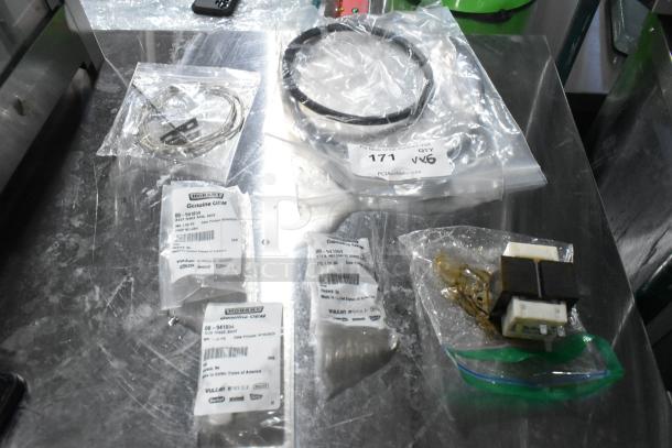 Five brand new Hobart parts in packaging, including 00-941854 hub rinse base, and 00-941859 rinse arm assembly.