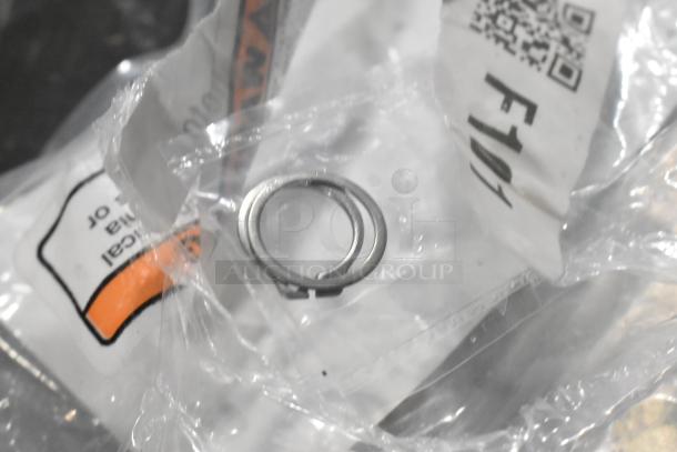 5 brand new Hobart parts in packaging including Hub Rinse Base and Rinse Arm Assembly. Labels visible.