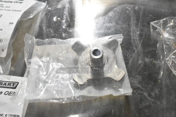 5 new Hobart parts in packaging, including 00-941854 Hub Rinse Base and 00-941859 Rinse Arm Assembly, visible labels.