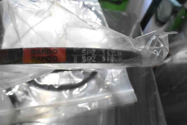 5 new scratch and dent items including Hobart parts and Bando belt with marking "SPZ 562LW" in original packaging.