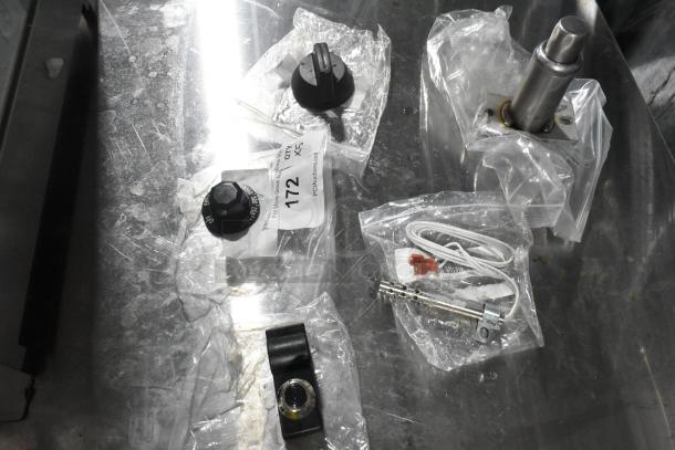 Brand new Southbend parts, including T-Stat knob and hot surface ignitor, in original packaging, minor scratches.