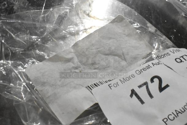 Clear plastic bag with a torn paper label showing partial barcode and auction lot number 172.