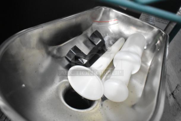 Alt text: Stainless steel tray with grinder accessories for Vollrath MIN0012 meat grinder, including white plastic pushers.