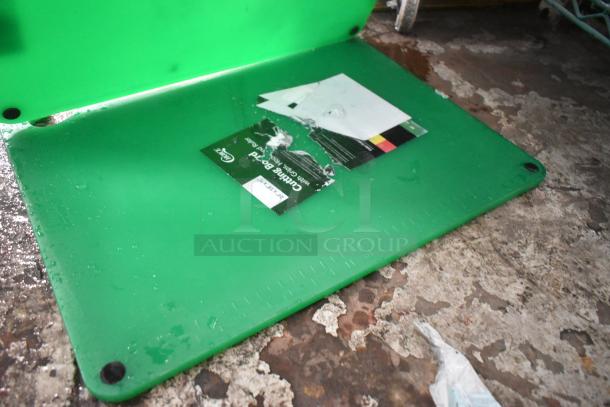 2 brand new Choice 407CBG2418GN 24"x18" green cutting boards with grips, hook, rulers; light scratches visible.