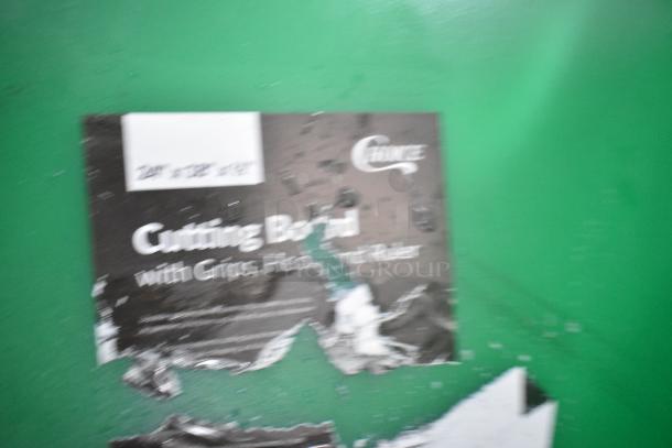 2 new scratched Choice 407CBG2418GN cutting boards, 24"x18"x1/2", green with grips, hook, rulers; visible damaged label.