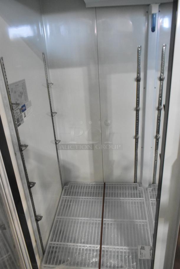 Brand new Avantco 178GDC49HCW 53" glass door refrigerator with customizable shelves, LED lighting, 115V, slight cosmetic dents.