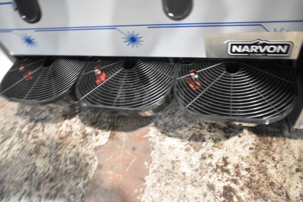 Brand new Narvon stainless steel commercial countertop slushie machine with 3 hoppers. Scratch and dent condition.