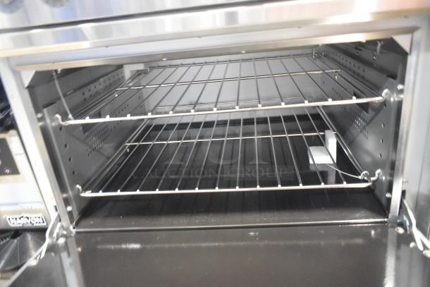 BRAND NEW SCRATCH AND DENT! 2024 CPG 351ER36SD Electric Range, stainless steel, 6-burner, oven racks shown, 240V, 1 phase.