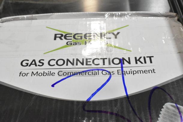 Regency 48" gas connector hose kit in packaging, labeled for mobile commercial equipment. Includes 2 elbows, valve, and quick disconnect.