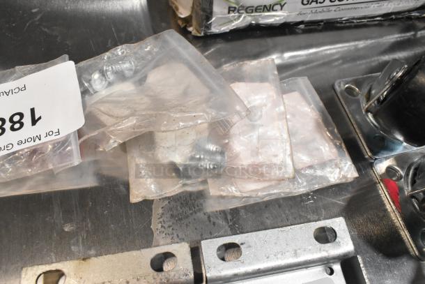 Lot of various items with 4 commercial casters, marked as brand new scratch and dent. Includes hardware in clear bags.