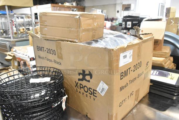 Box of Xpose Safety 20' x 30' black heavy-duty mesh tarp BMT-2030, brand new, labeled "Mesh Tarps-Black, QTY: 1 PC."