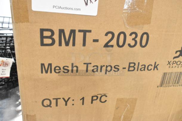 Box labeled "BMT-2030 Mesh Tarps-Black," containing Xpose Safety 20' x 30' black mesh tarp, heavy-duty, weatherproof.