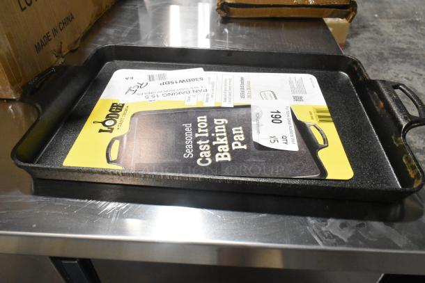 Lodge 15.5"x10.5" pre-seasoned cast iron roasting pan, model 530BW15BP. New, scratch and dent. Pack of 5, tags visible.