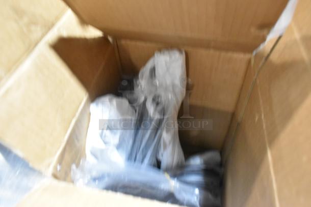 Box containing Amefa table knives and forks in plastic packaging, brand new condition, 6 sets, some with minor scratches or dents.