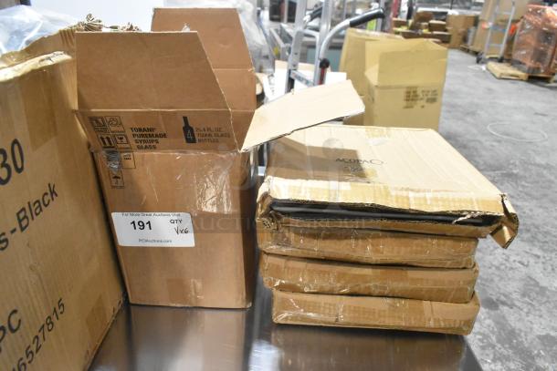 Cardboard boxes containing scratch and dent Amefa table knives and forks in warehouse setting, labeled as auction lot.