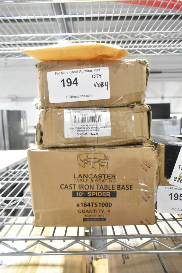 Four brand new items in boxes; includes Lancaster cast iron table base 10" spider, model 164TS1000; ideal for auctions.