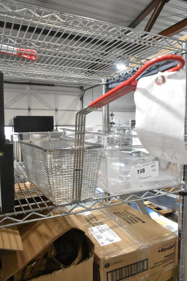 Brand new Hobart 00-499223-00001 twin basket, scratch and dent condition, metal mesh with red handle, on a metal shelf.