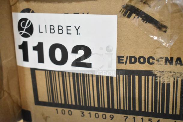 Label on a box reading "Libbey 1102" with visible barcode, part of a new scratch and dent auction lot.