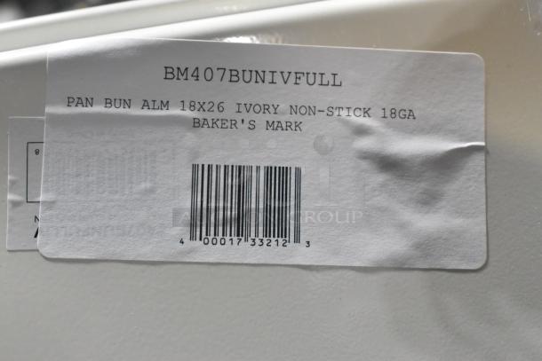 Label on BM407BUNIVFULL pan, indicating 18x26 ivory, non-stick, 18GA by Baker's Mark. Scratch and dent item.