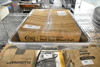 Brand new Choice 13 Qt. aluminum roasting pan with box of Choice half-size 19 gauge wire rim bun sheet pan.