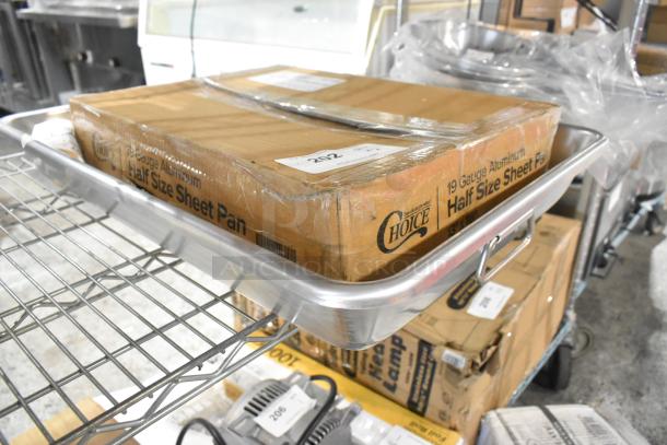 Brand new Choice 13 Qt. aluminum baking pan and 19 gauge half-size sheet pan; minor scratches, both in packaging.