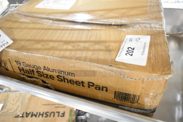 Sealed box containing a new Choice Half Size 13"x18" 19 Gauge Aluminum Bun/Sheet Pan, minor box dents visible.