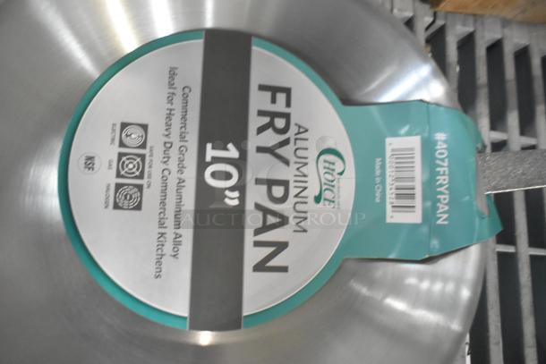 6 new Choice 10" aluminum fry pans, scratch and dent, commercial grade, tagged #407FRYPAN. Ideal for heavy-duty kitchens.