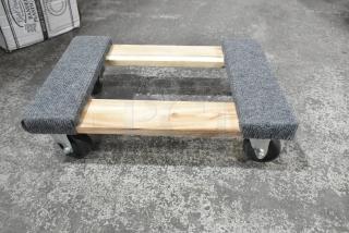 Brand new Lavex 257WD1812 18"x12" wood dolly with carpeted ends, supports 800 lbs, 3" wheels, minor scratches.