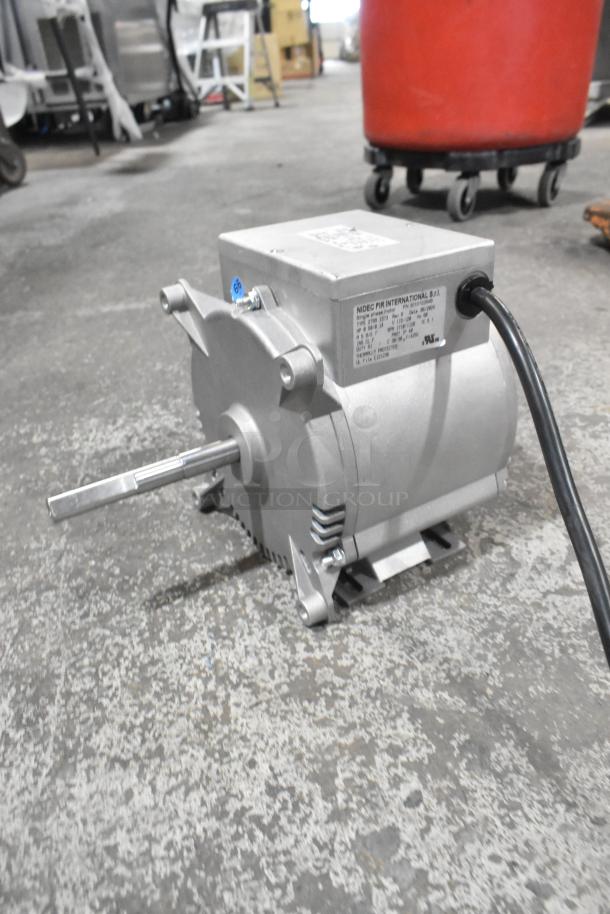 Brand new Nidec 2799 1573 motor, 115-120V, 1 phase. Visible scratch and dent. Labels confirm model and specs.