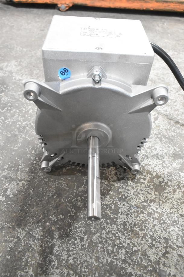 Brand new Nidec 2799 1573 motor, 115-120V, 1 phase, with minor scratches. ID tag visible. Features sturdy metal casing.