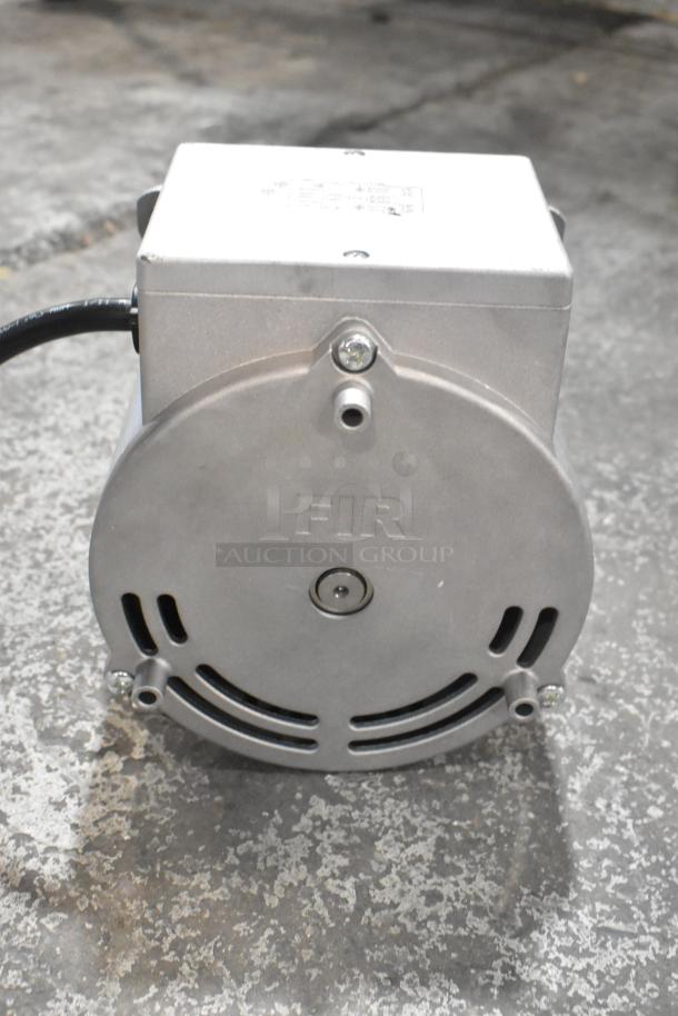 Brand new Nidec 2799 1573 motor, 115-120V, 1 phase, with minor scratches. Visible label indicates model details.