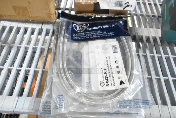 T&S B-0425-KIT Inlet Kit with 24" Hoses, 1/2" NPT Male x 3/8" Compression, in packaging on metal shelf.