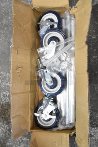 Lot of 4 commercial casters, brand new with minor scratches, blue and white wheels, metal brackets, in original open box.