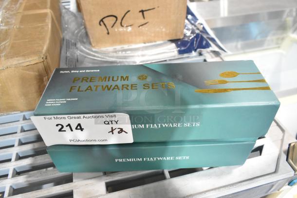 Two new boxes of Premium Flatware Sets, labeled "Scratch and Dent," quantity of 2. Boxes have a stylish design.