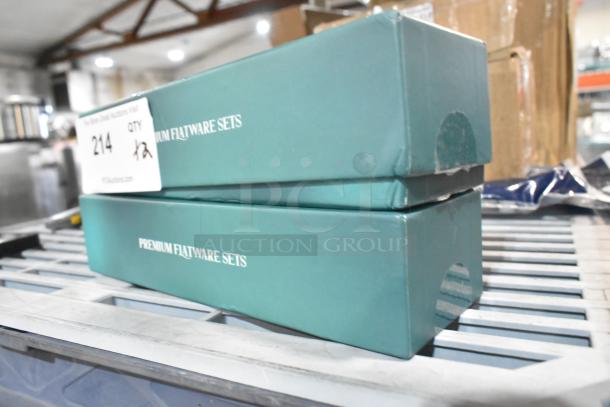 Two brand new scratch and dent boxes of premium flatware sets, teal packaging, labeled "214 1/2."