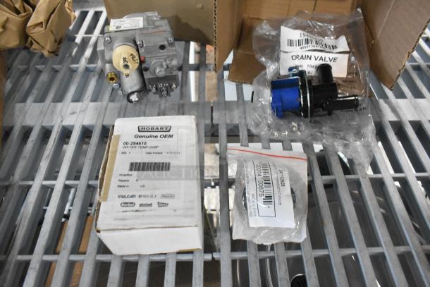 Four new scratch and dent items including Hobart 00-294618 temp control kit, MainStreet Equipment 541103628 thermostat knob, Avantco Ice 19494430 drain valve, Robertshaw 3598514B7A natural gas millivolt valve.