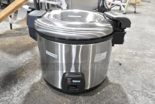 Brand new Galaxy 177RCSG60 electric rice cooker/warmer. Scratch and dent condition, 120V, 1 phase. Caution labels visible.