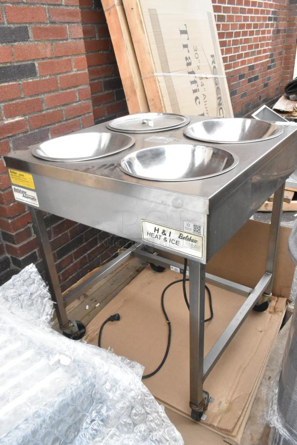 Belshaw H&I-4 stainless steel heat and ice station, 208V, 1 phase, 4 stainless steel bowls, mounted on a wheeled frame.