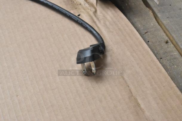Belshaw H&I-4 Heat and Ice Station power plug, 208V, 1 Phase, on a cardboard surface.